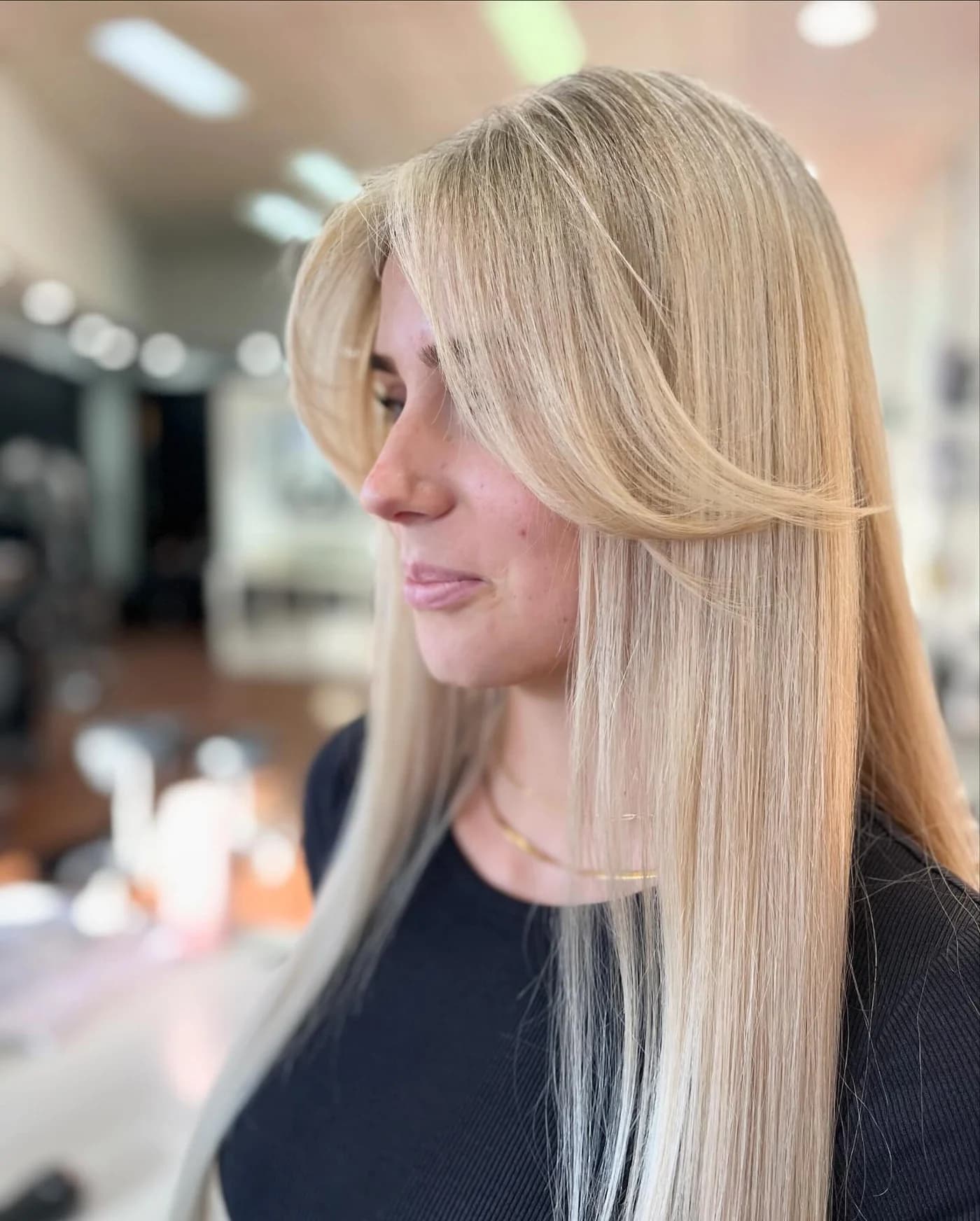 Smooth blonde hair with a softly shaped face frame