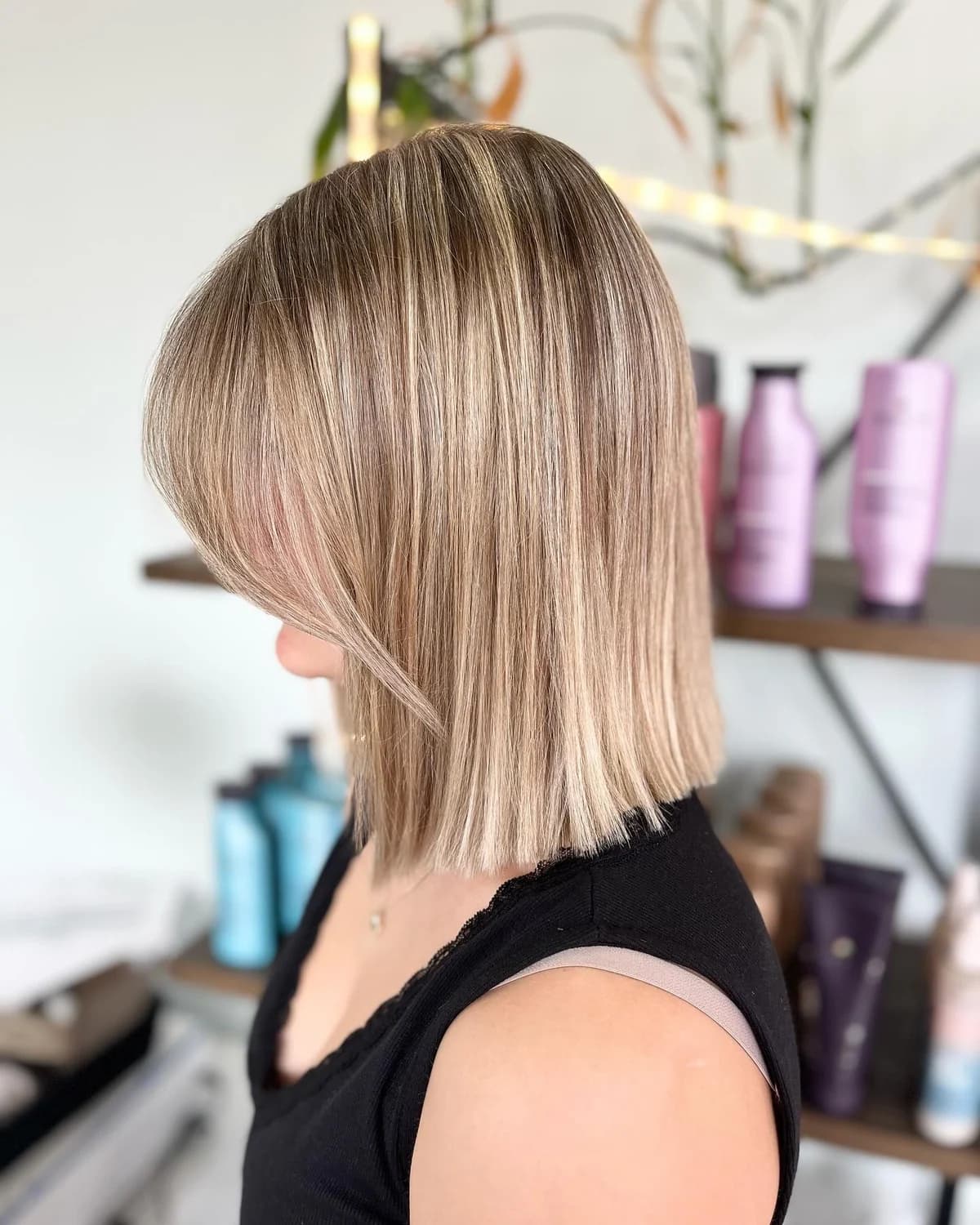 Neatly cut blonde bob with a smooth, straight finish